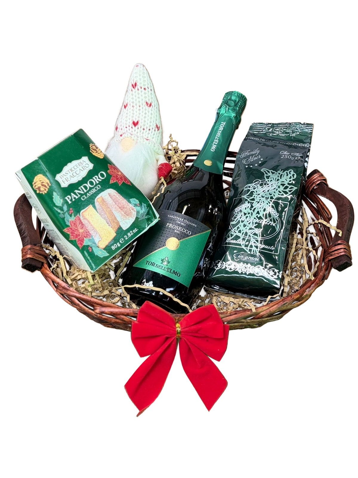 Coșul SELECTED Moments: prosecco, cafea și pandoro, alături de un gnom textil, într-un coș împletit cu fundă roșie.